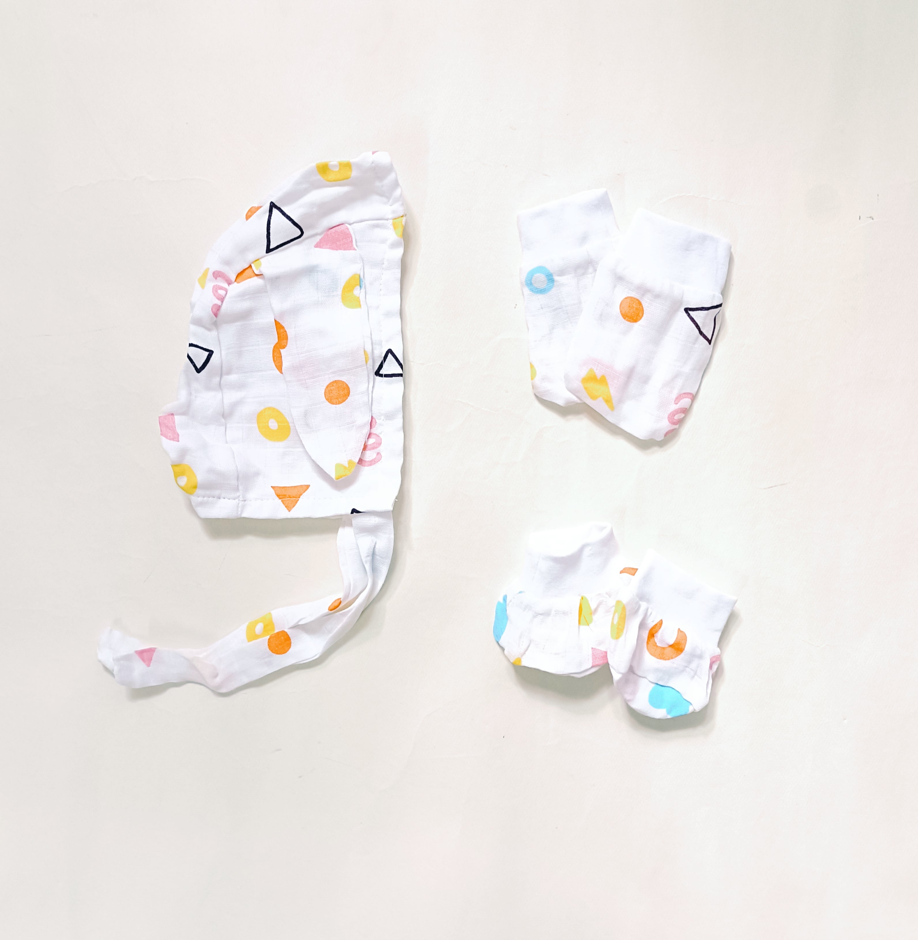 Muslin Cap, Mittens, Socks | Geometry